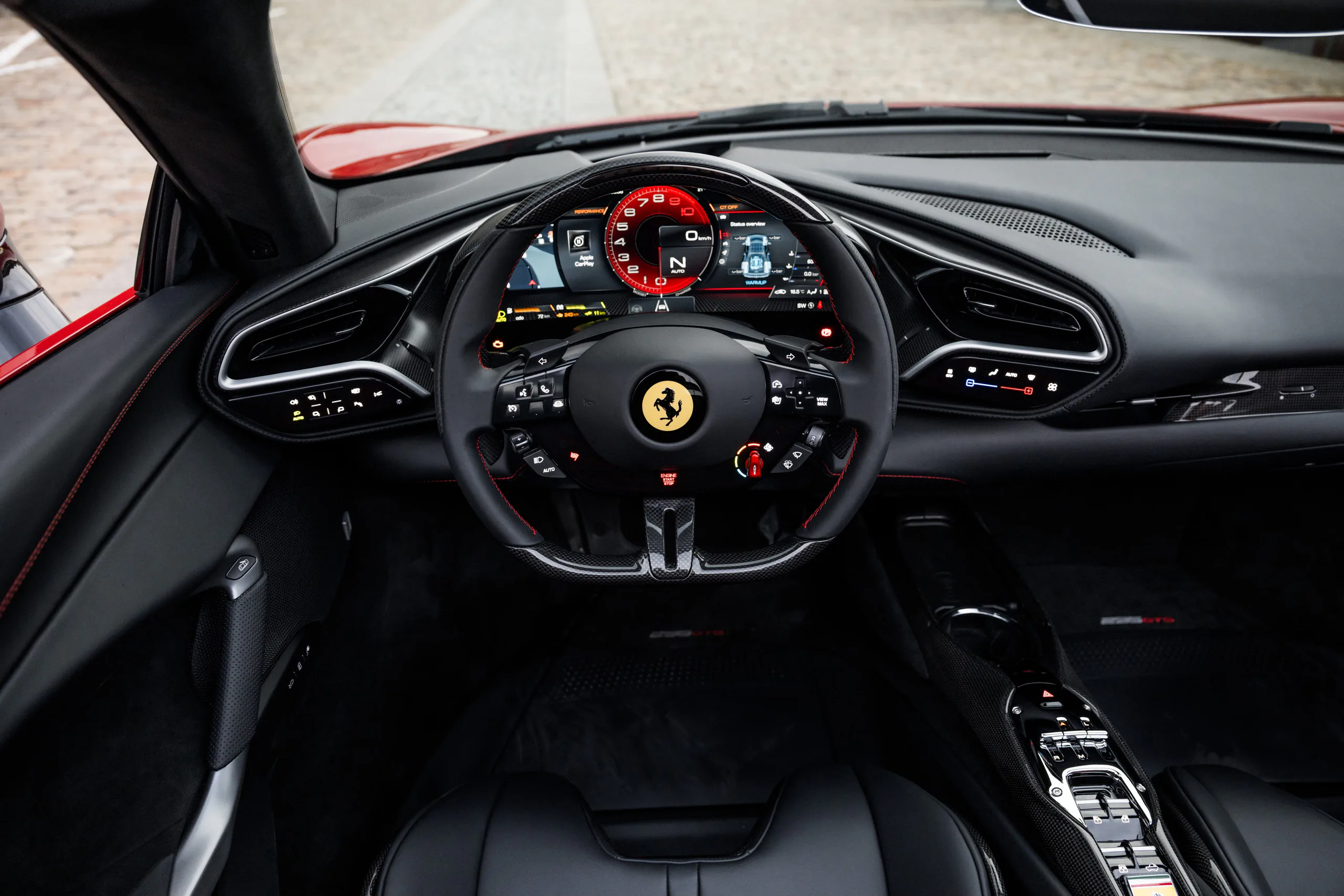 Ferrari 296 GTS cockpit with steering wheel and digital instrument cluster