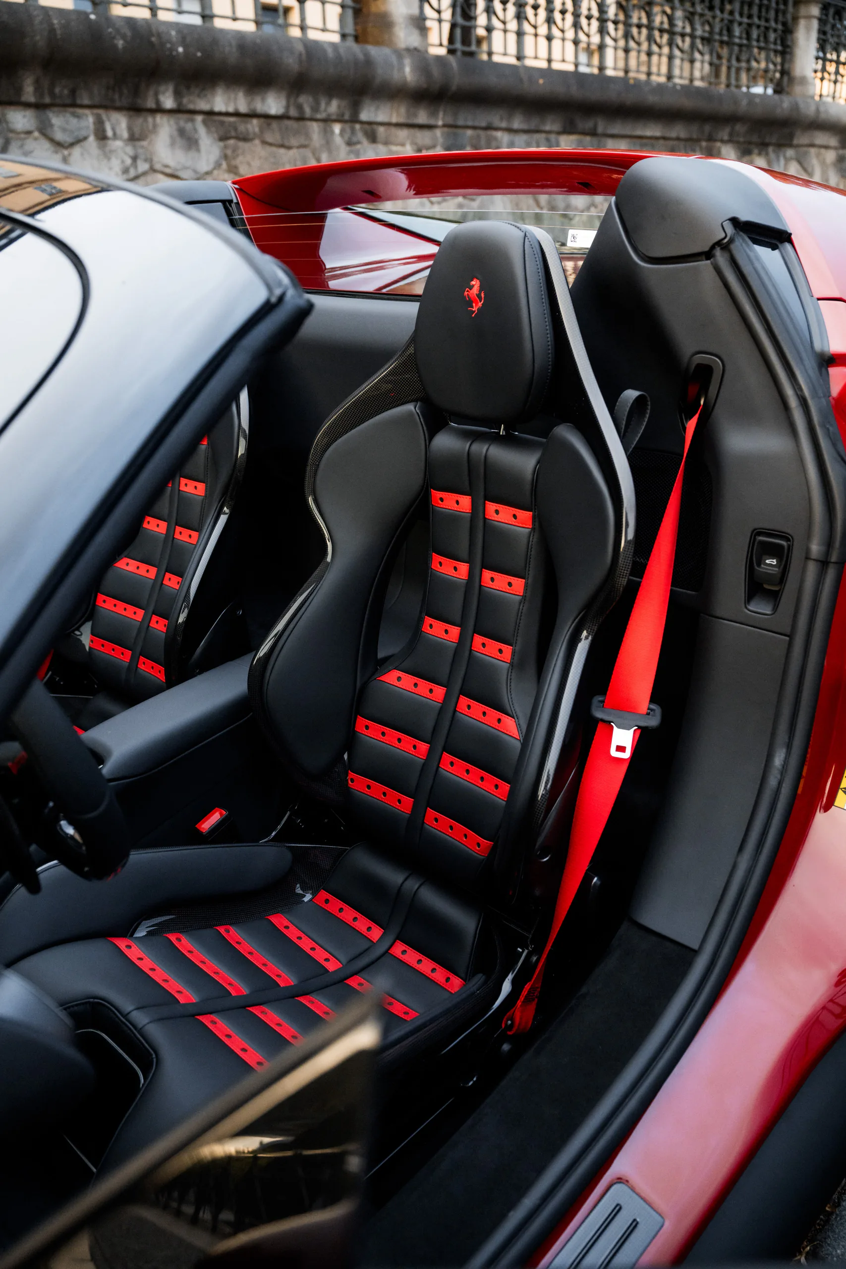 Ferrari 296 GTS seats with red inserts and red seat belts