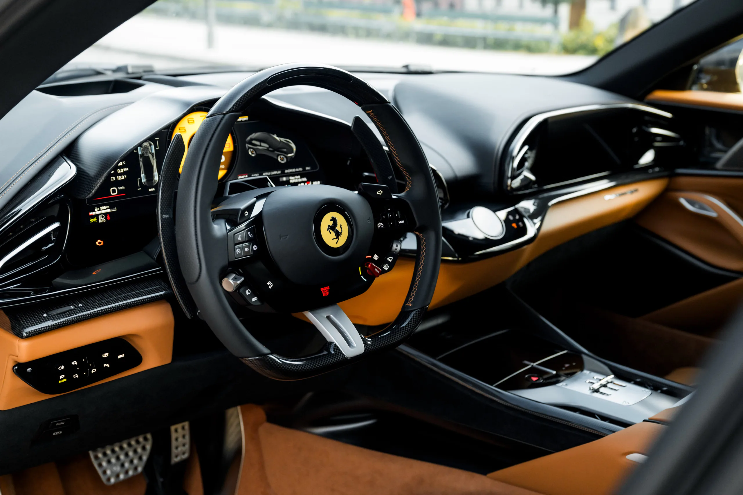 Ferrari Purosangue dashboard and steering wheel in black and tan